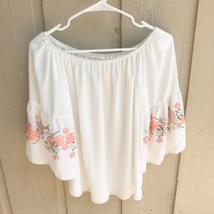 Bright floral long sleeved off-the-shoulder top